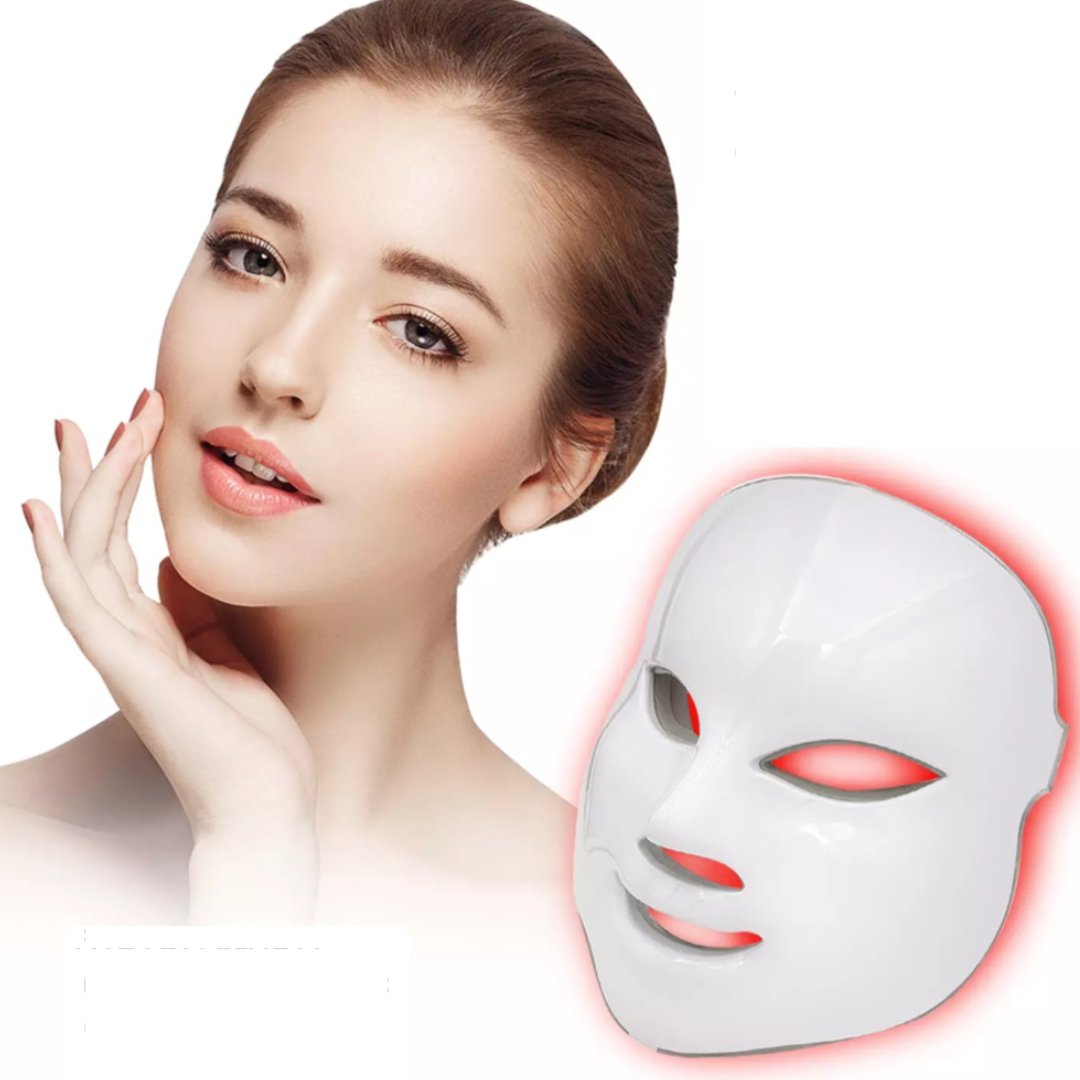 Woman with beautiful skin touches her face, LED light therapy mask with red light